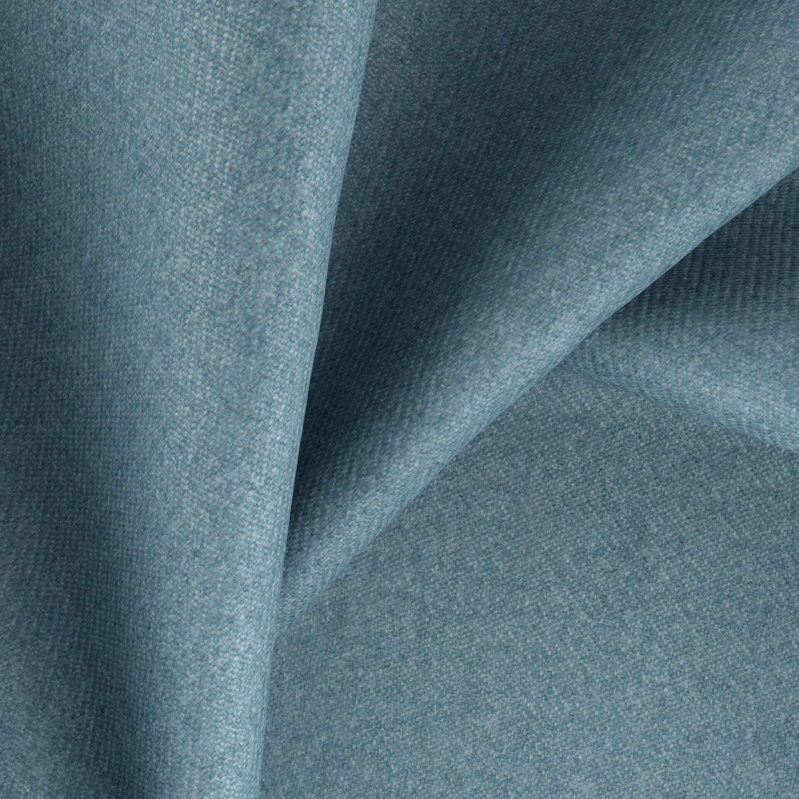 Muted blue-teal woven fabric folded to show fine grain and shaded texture