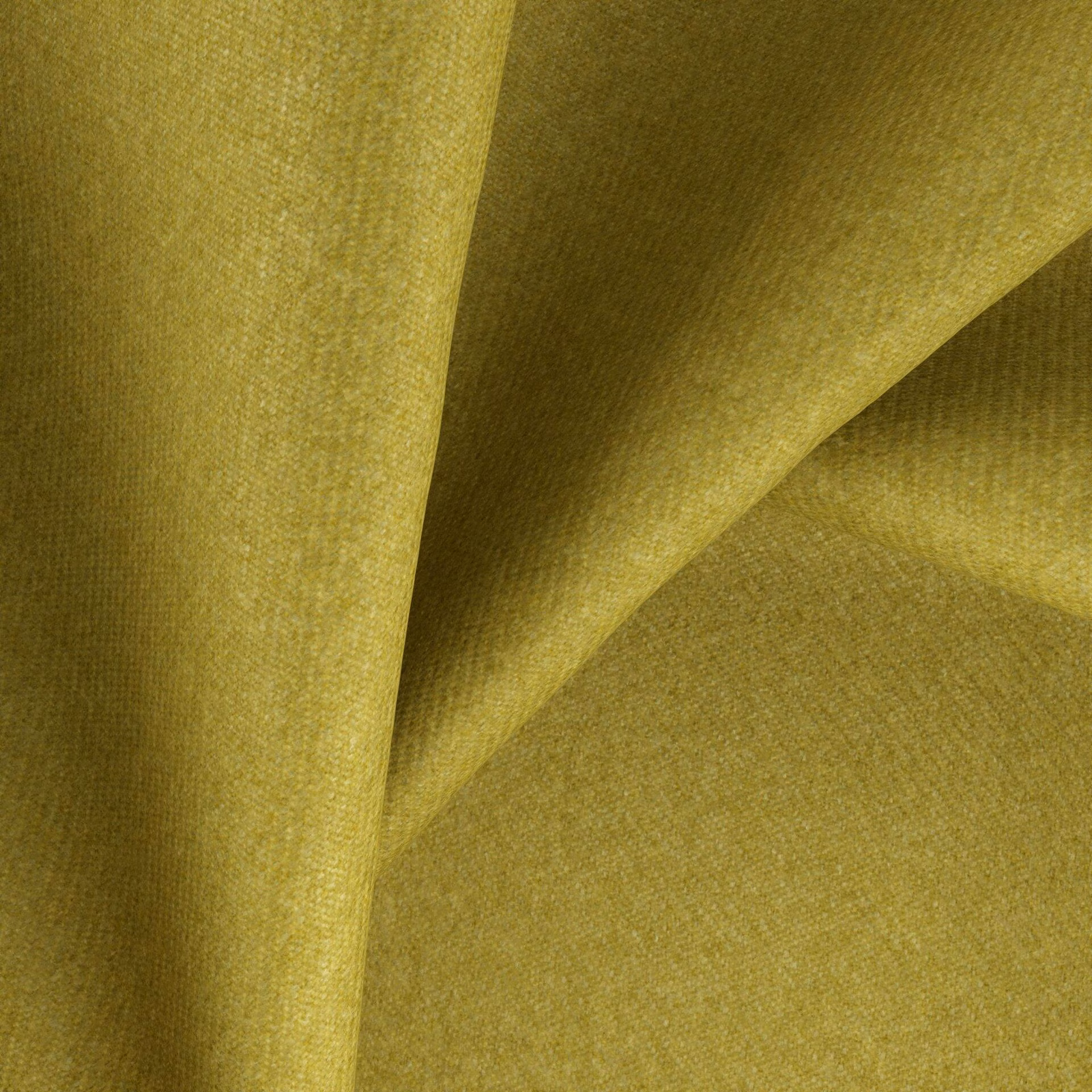 Close view of muted lime-olive woven fabric with fine texture and soft folds