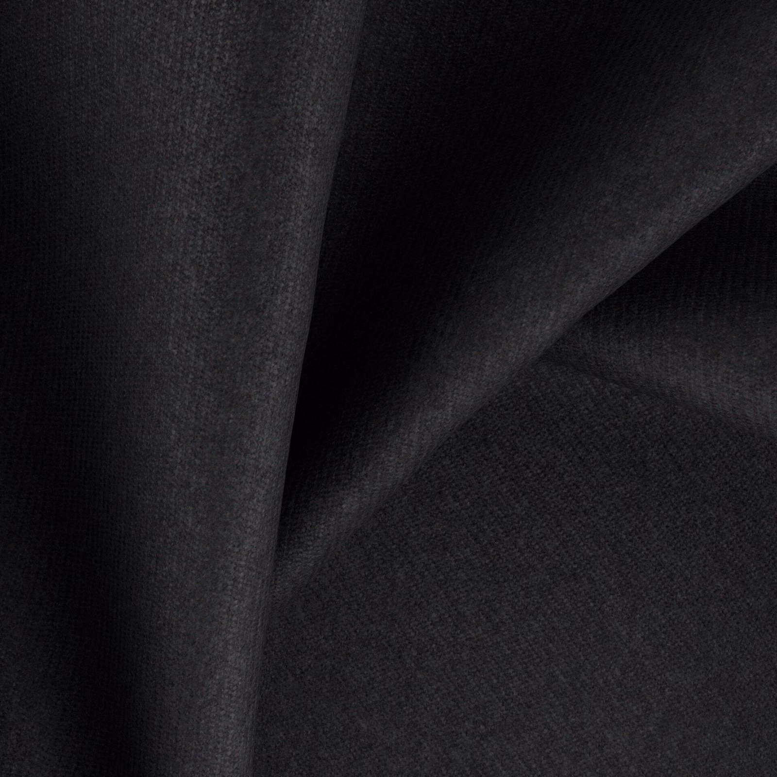Folded near-black charcoal fabric showing a fine, subtly shifting woven texture