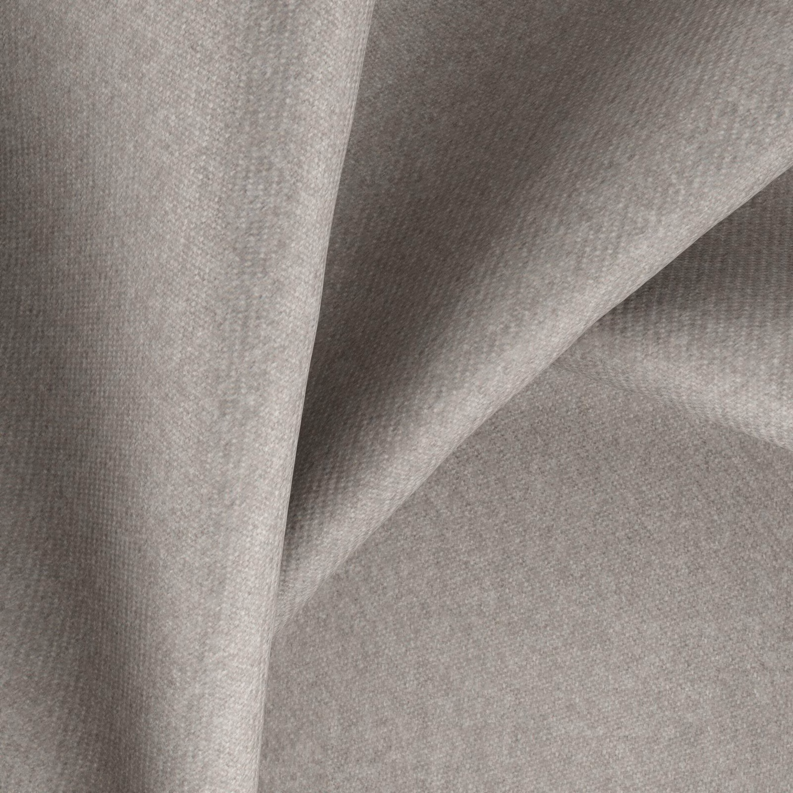 Warm pebble-grey fabric with a fine woven texture folded into soft angular drapes