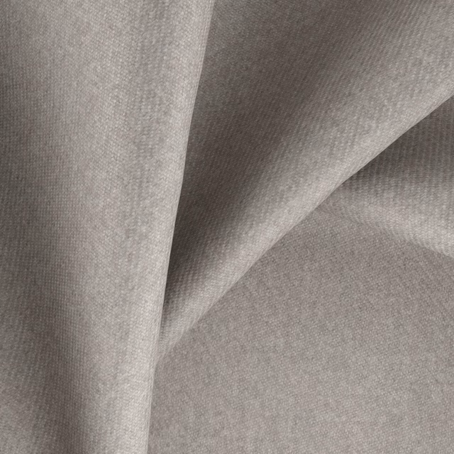 Warm pebble-grey fabric with a fine woven texture folded into soft angular drapes