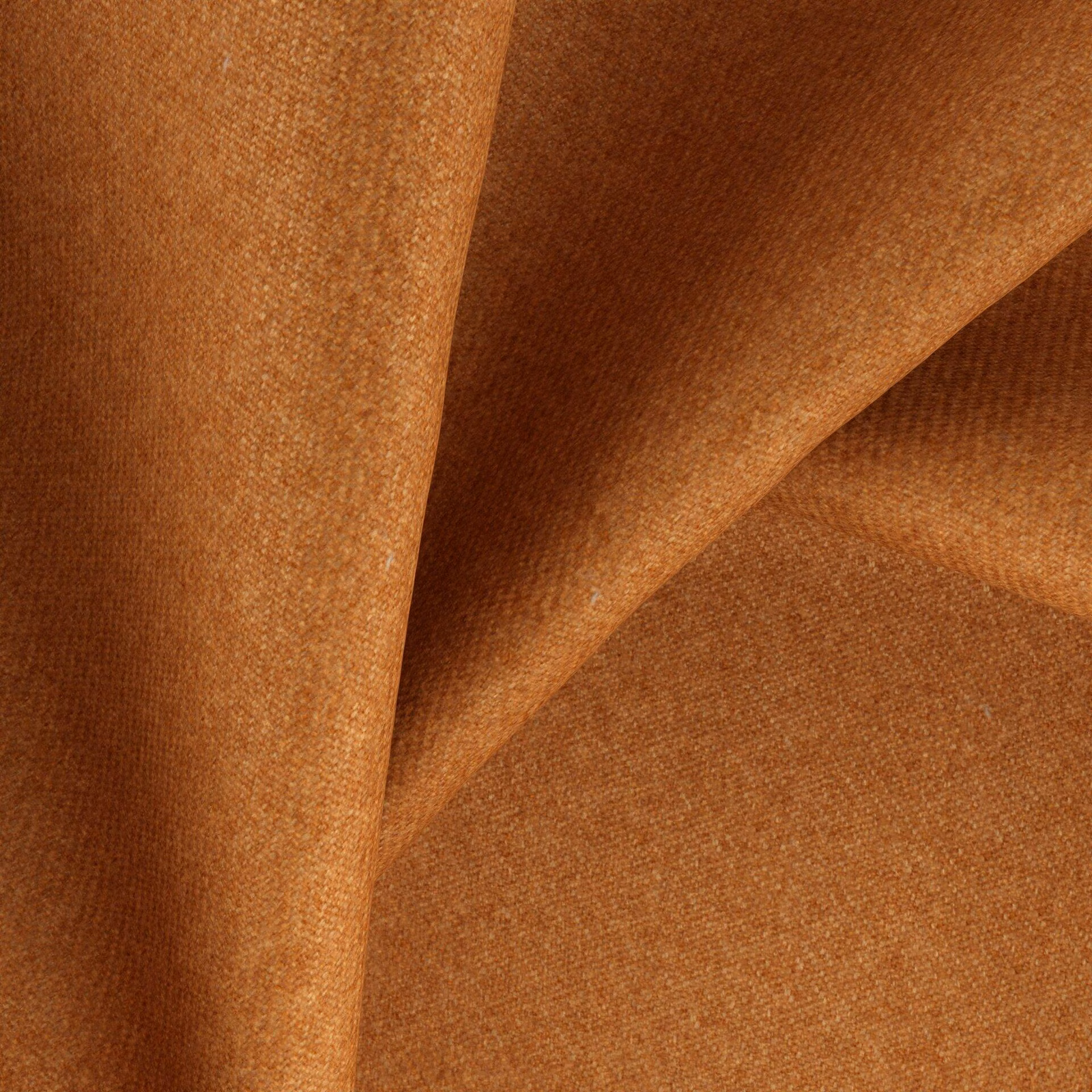 Burnt pumpkin-orange fabric with a dense fine woven texture in folded swatch