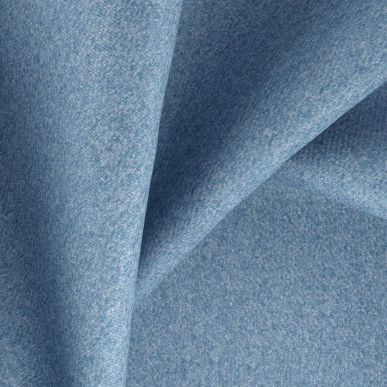 Close-up of muted sea-blue woven fabric with softly mottled blue-grey texture