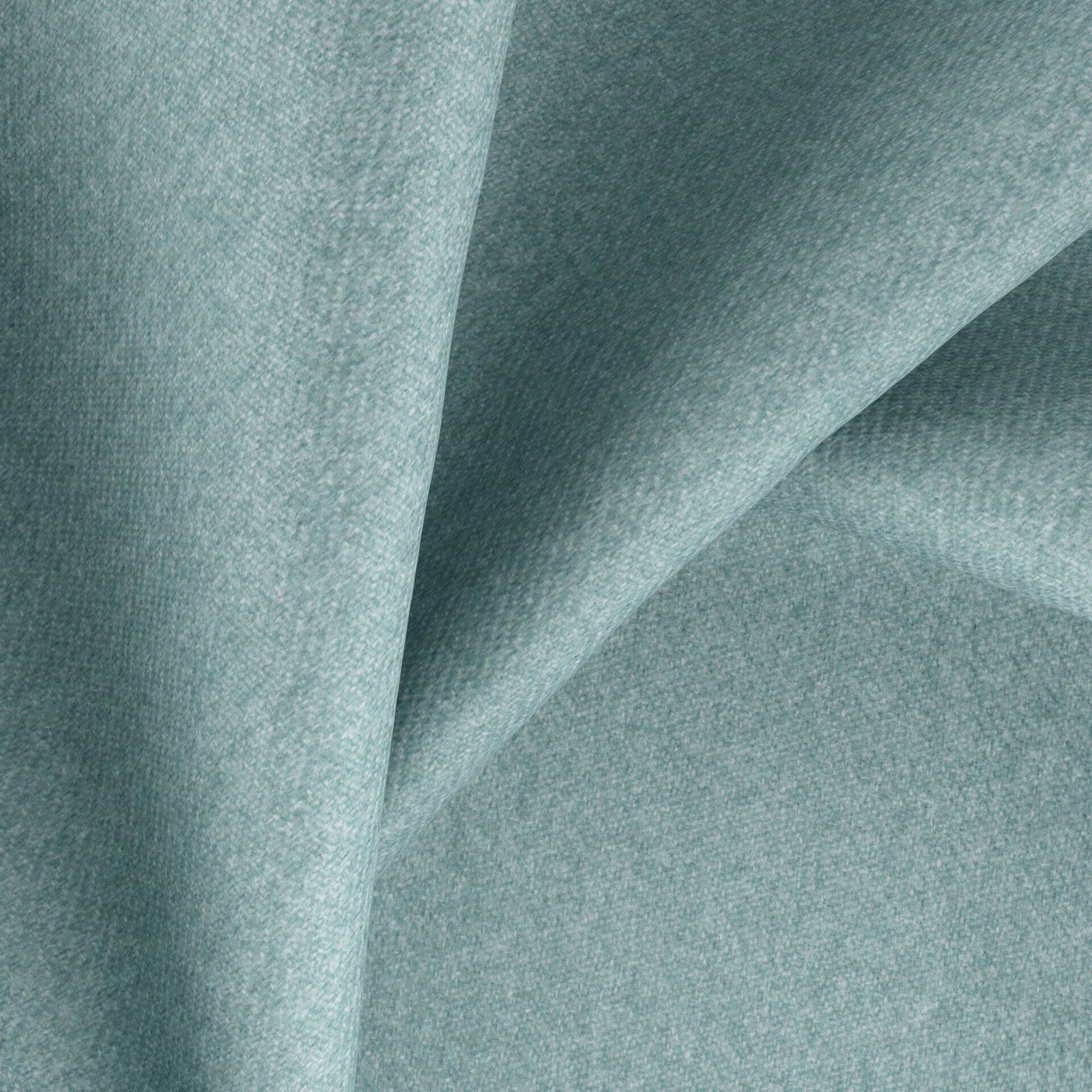 Close-up of soft spearmint plain weave fabric with a gently folded surface