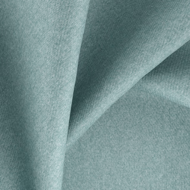 Close-up of soft spearmint plain weave fabric with a gently folded surface