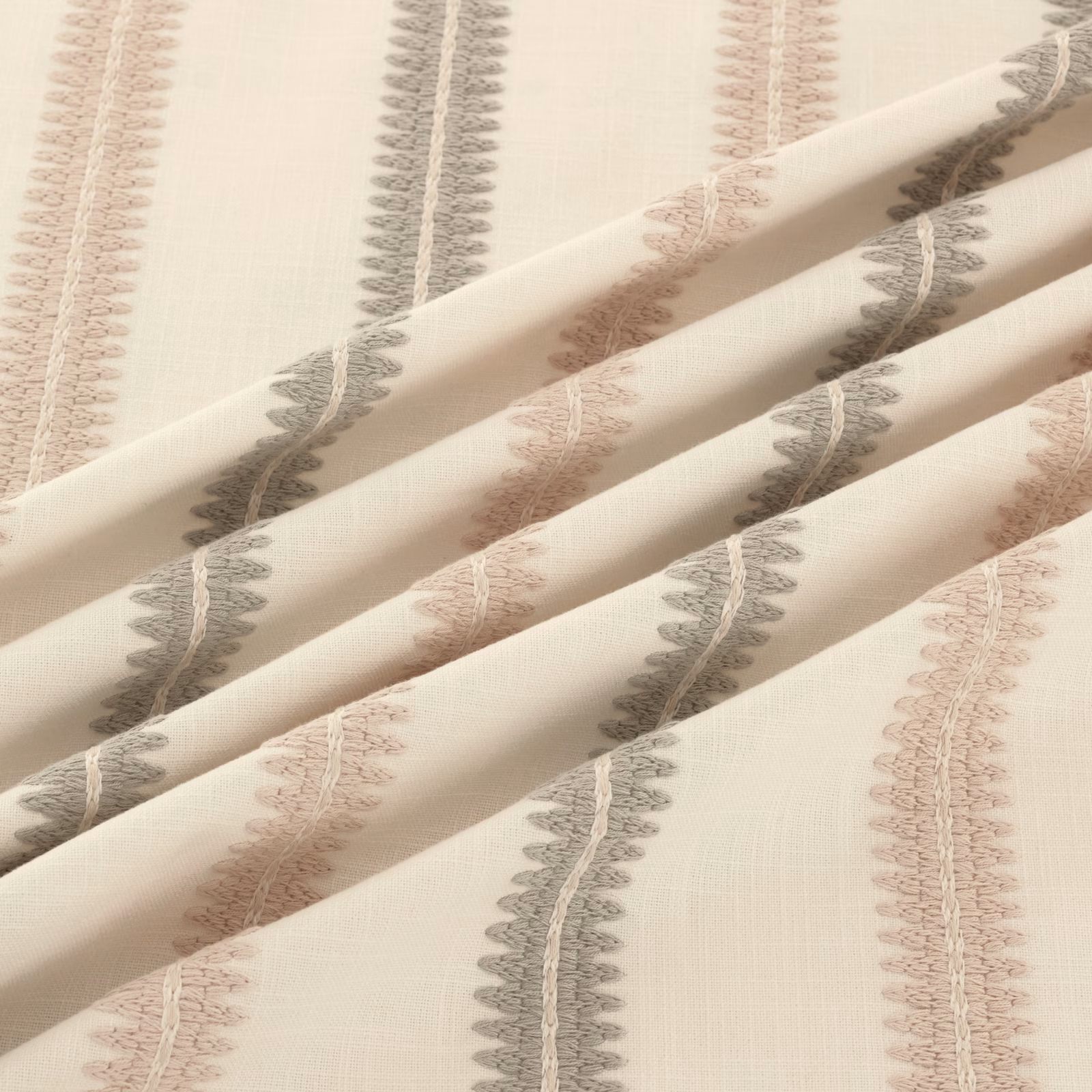 Oyster ground with vertical grey and blush scalloped motifs in soft folds