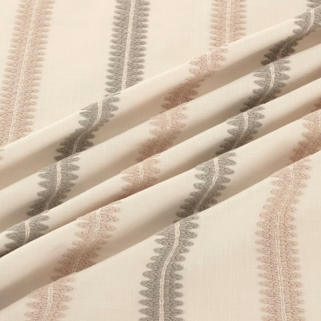 Oyster ground with vertical grey and blush scalloped motifs in soft folds