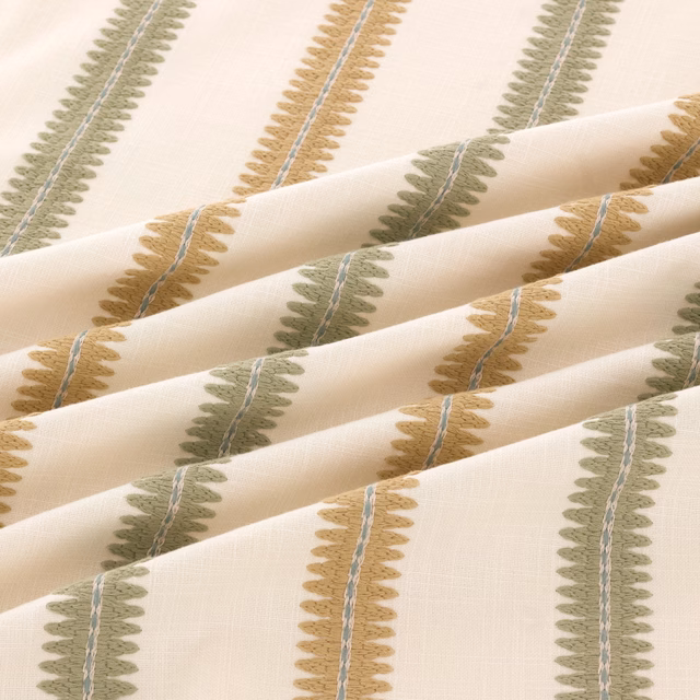 Cream woven swatch with olive and ochre leaf stripes and blue-grey lines