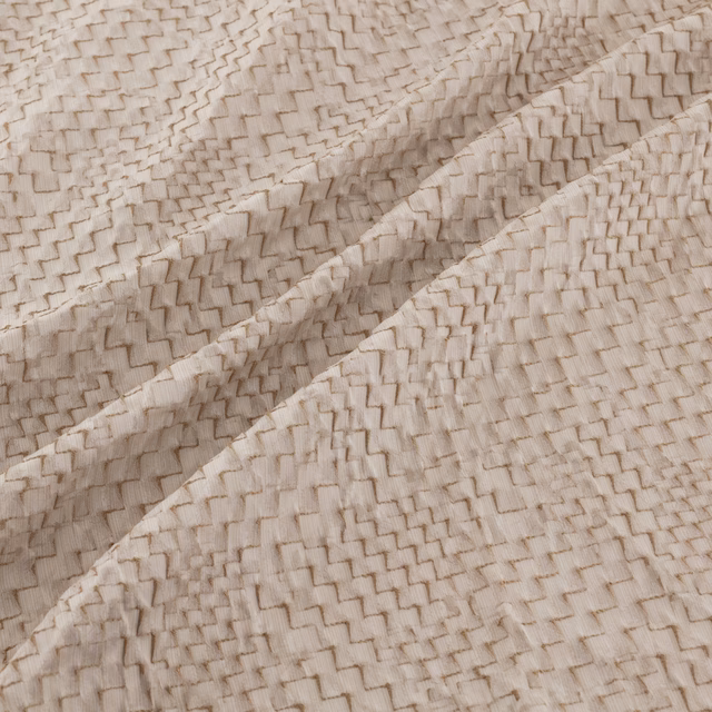 Pale sandstone beige fabric with a raised, tightly woven zigzag texture