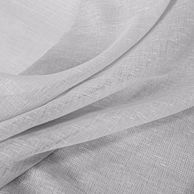 Pale pebble-grey woven fabric with fine crosshatch texture in softly folded layers