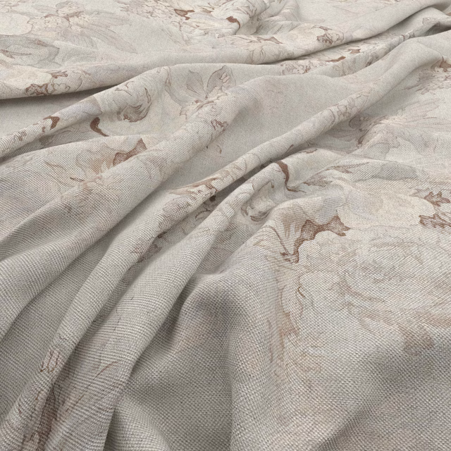 Dove-grey botanical fabric with taupe motifs falling in soft fluid folds