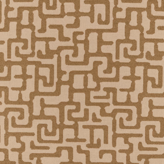 Warm taupe and cream fabric with a textured interlocking geometric meander