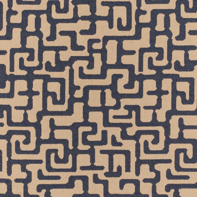 Warm beige woven fabric with dense deep navy interlocking maze motifs