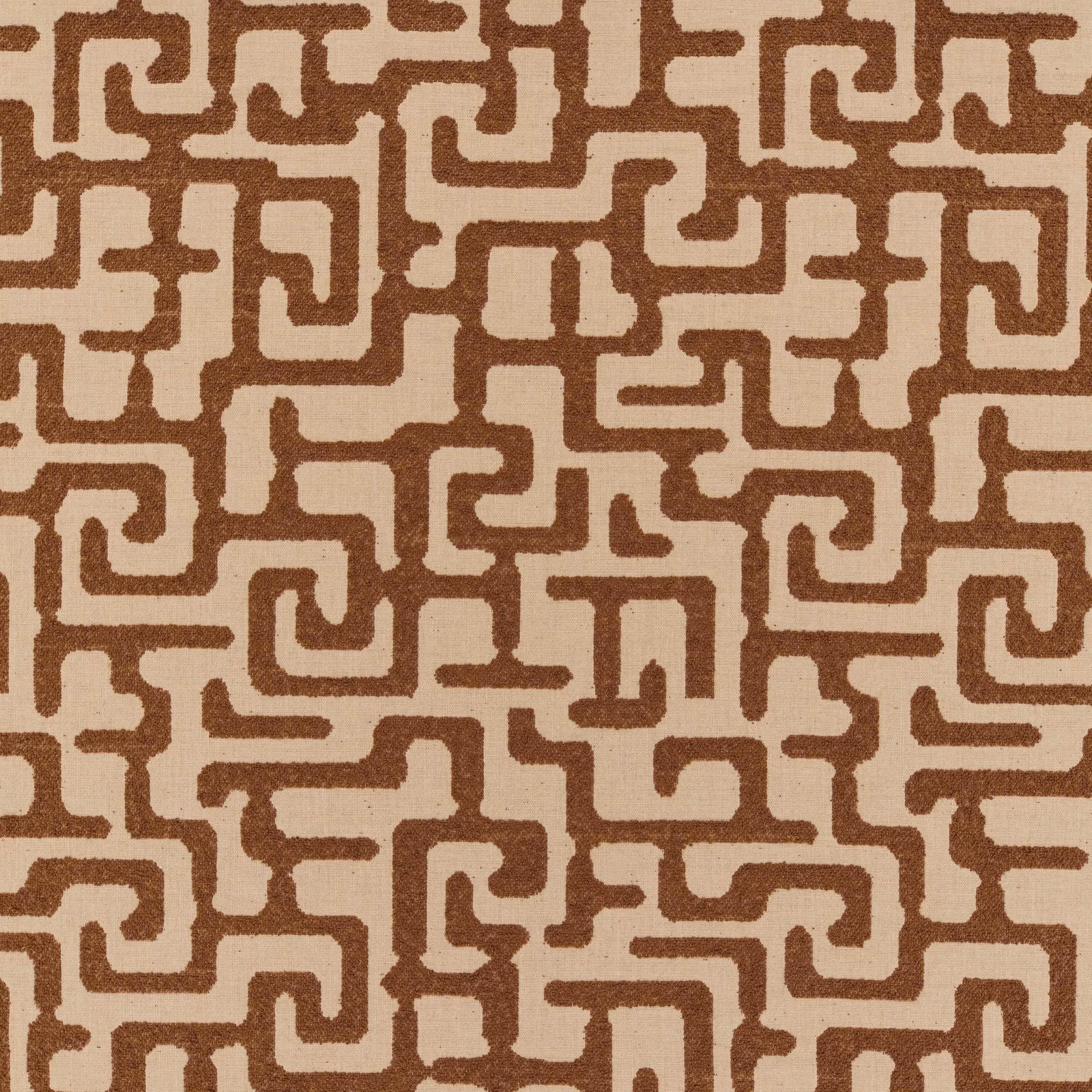 Warm tan woven fabric with brown maze-like geometric lines and softly textured surface