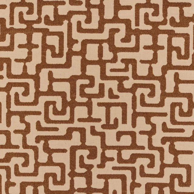 Warm tan woven fabric with brown maze-like geometric lines and softly textured surface