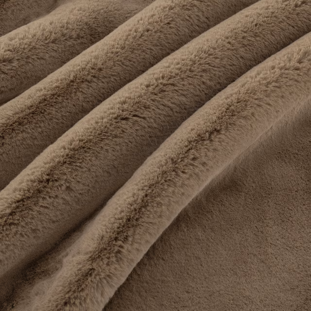 Warm taupe-brown plush pile fabric folded in softly shaded diagonal ridges