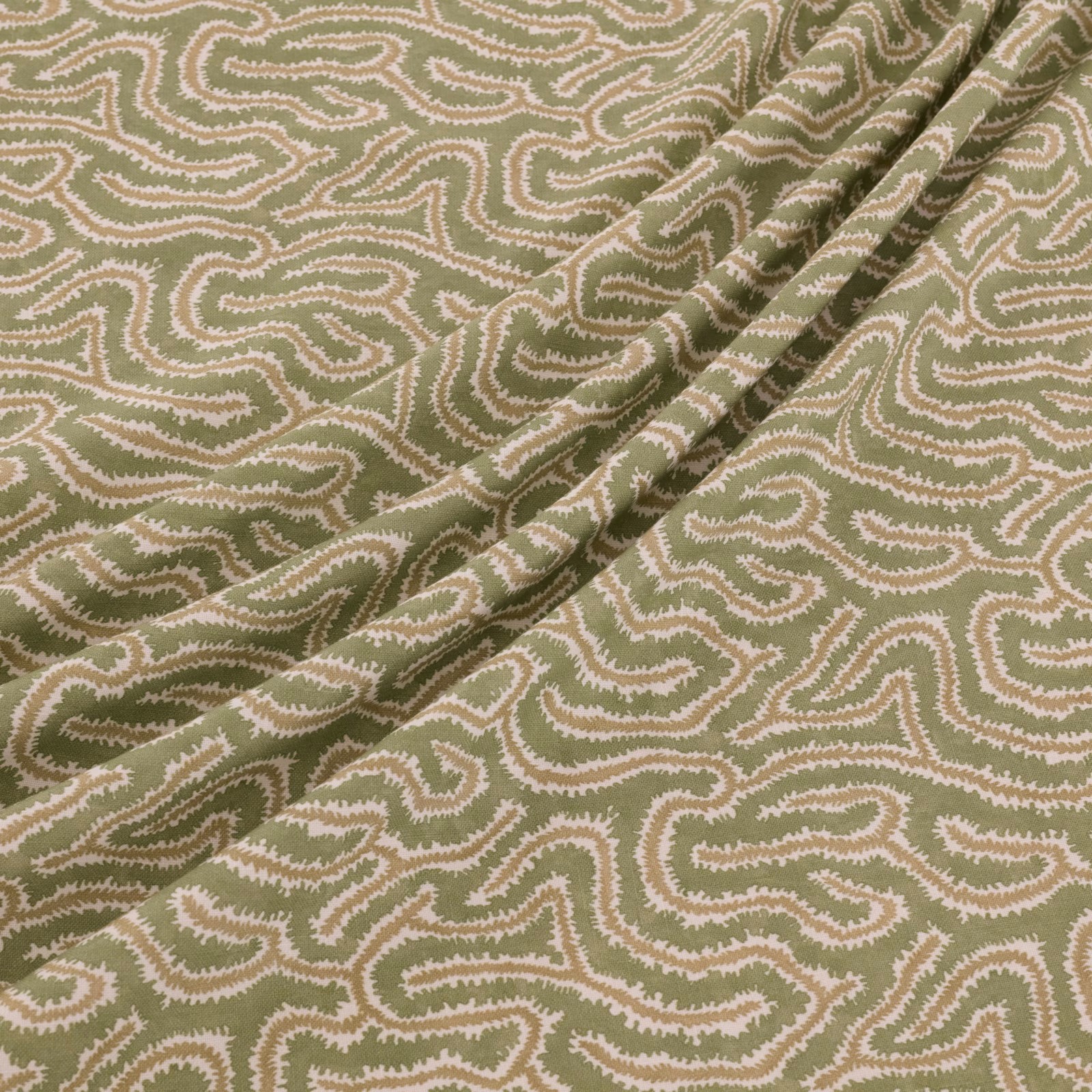Muted olive Kelp fabric with cream and blush meandering paisley lines in a folded swatch