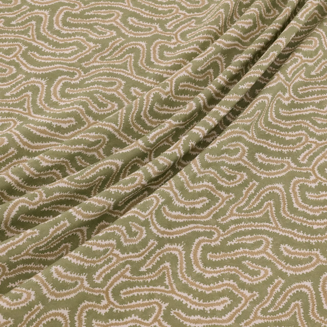 Muted olive Kelp fabric with cream and blush meandering paisley lines in a folded swatch
