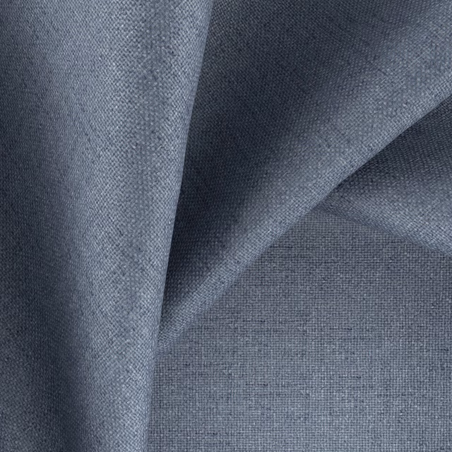 Deep blue-grey woven textile showing fine plain texture and softly shaded folded surface