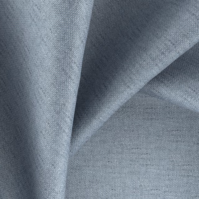 Cool blue-grey folded swatch showing a fine, subtly mottled woven texture