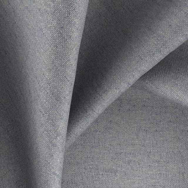 Charcoal-grey woven fabric with warm flecks and fine textured crossweave in folded swatch