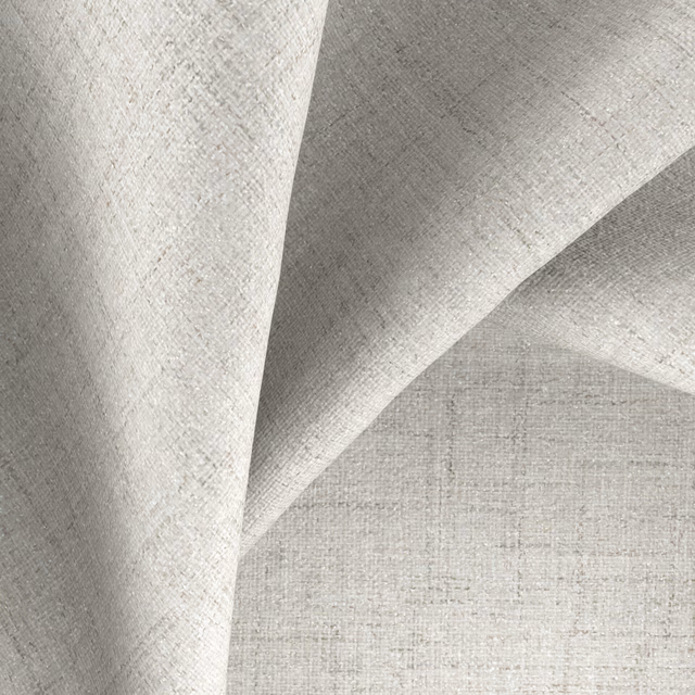 Pale mist-grey woven textile folded to reveal a fine, softly flecked surface