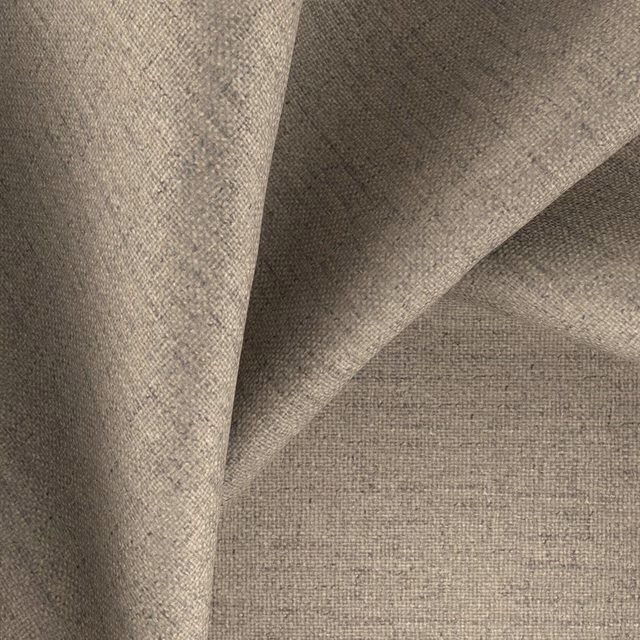 Warm mocha-taupe woven fabric folded to show its fine, subtly mottled texture