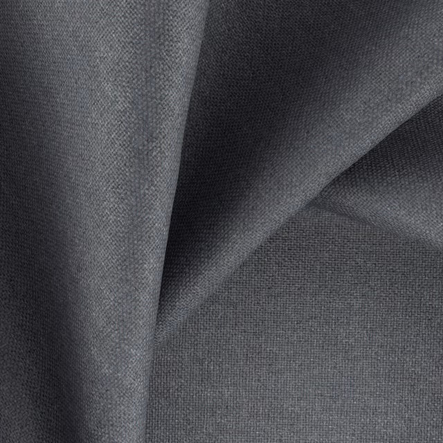 Charcoal-black crosshatch weave folded into softly lit ridges