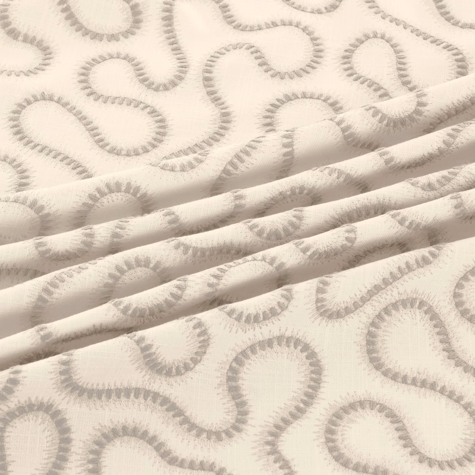 Ivory fabric with soft dove-grey looping motifs and a lightly textured weave in folded layers