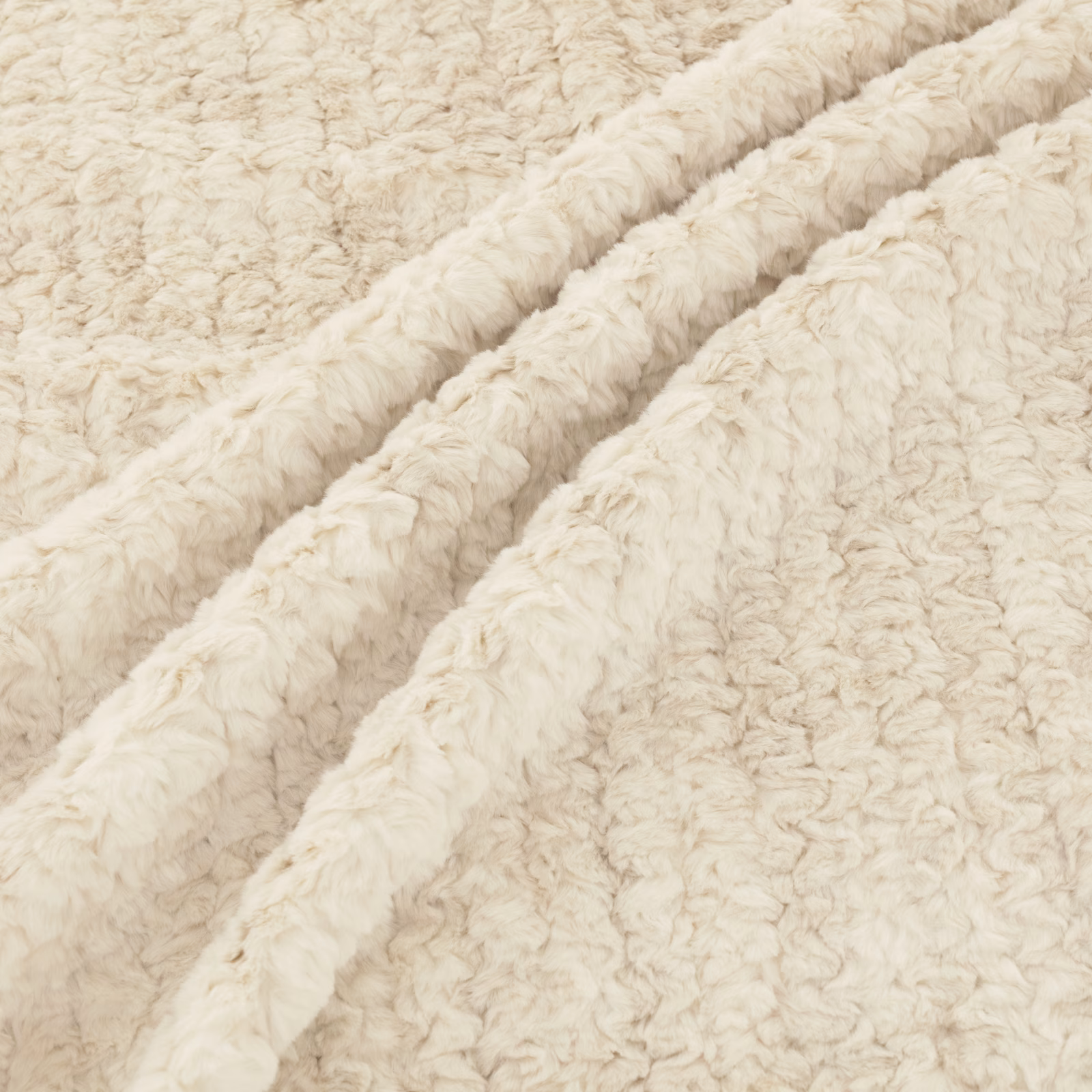 Warm ivory cream fabric with shaggy curly pile gathered into deep soft folds