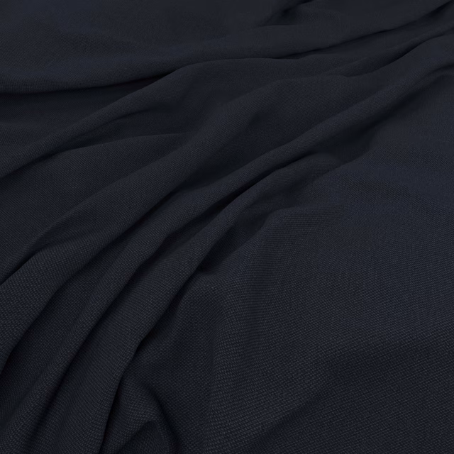 Deep blue-black Oxford fabric showing fine woven texture across soft draped folds