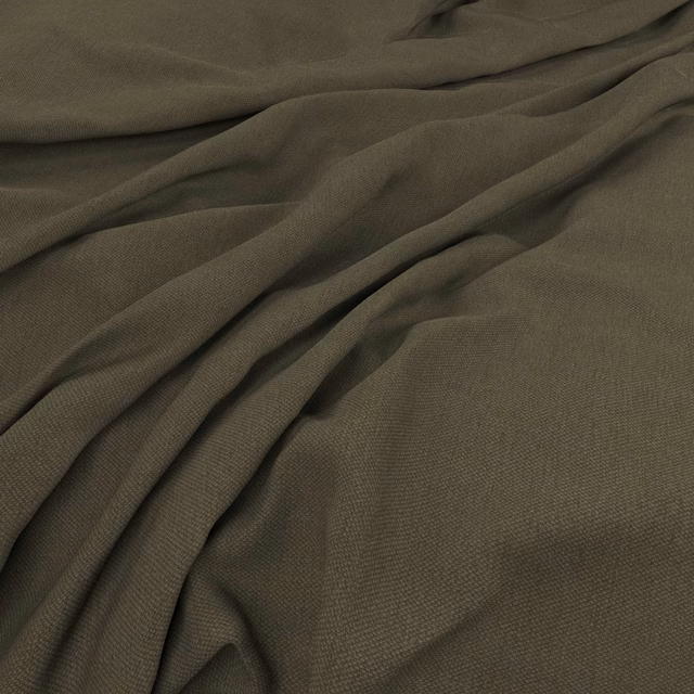 Muted olive-khaki fabric with fine weave gathered into soft shadowed folds