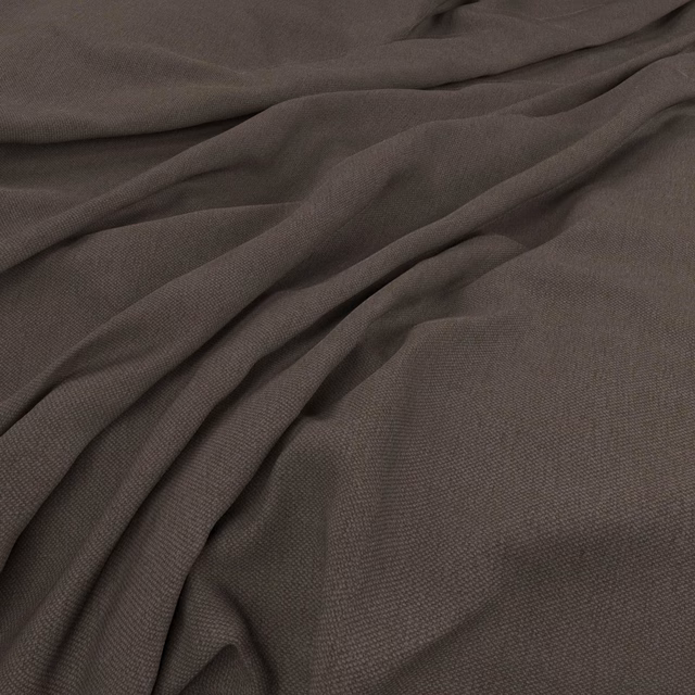 Warm mocha-taupe plain weave fabric gathered into softly shadowed folds