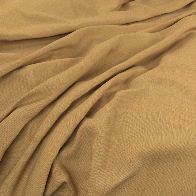 Warm ochre mustard fabric showing a fine weave and softly gathered folds