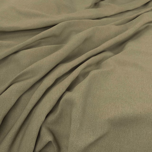 Muted sage-green plain weave fabric falling into soft, fluid folds