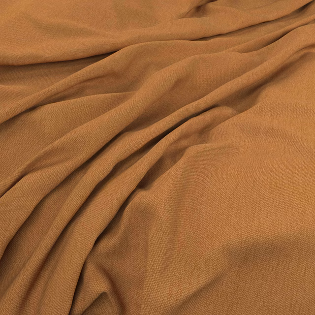 Warm spice-brown woven fabric gathered into softly shadowed folds