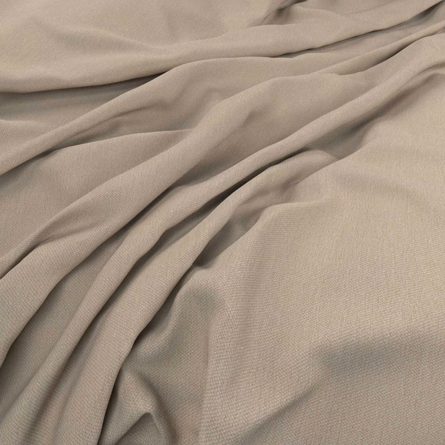 Close-up of warm stone taupe fabric with fine plain weave and soft gathered folds