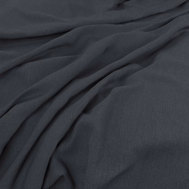 Deep charcoal-grey woven cloth gathered into soft, fluid diagonal folds