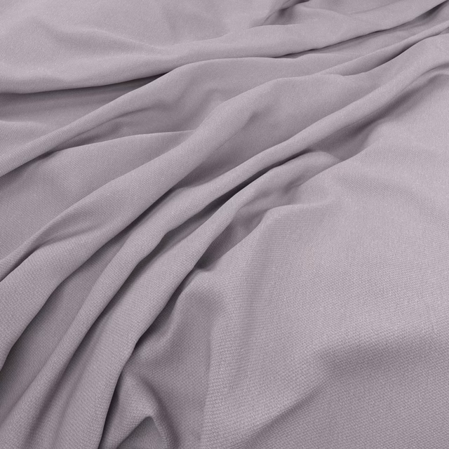 Muted lavender-purple plain weave fabric gathered into soft fluid folds