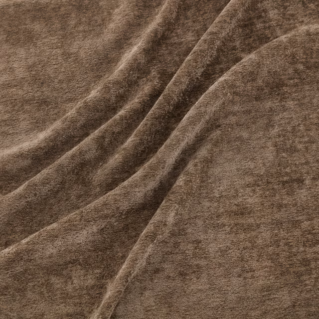 Warm tawny-brown napped fabric with soft diagonal folds and plush surface