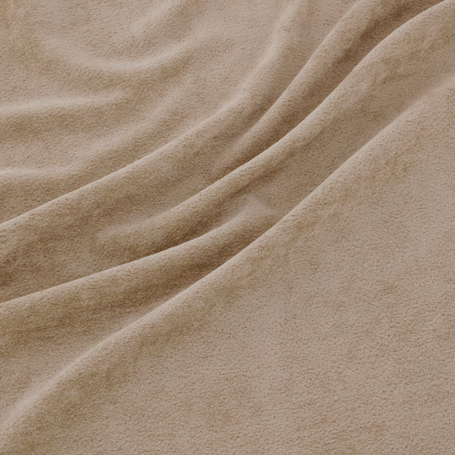 Warm wheat-beige plush fabric with soft folds and a short, velvety nap
