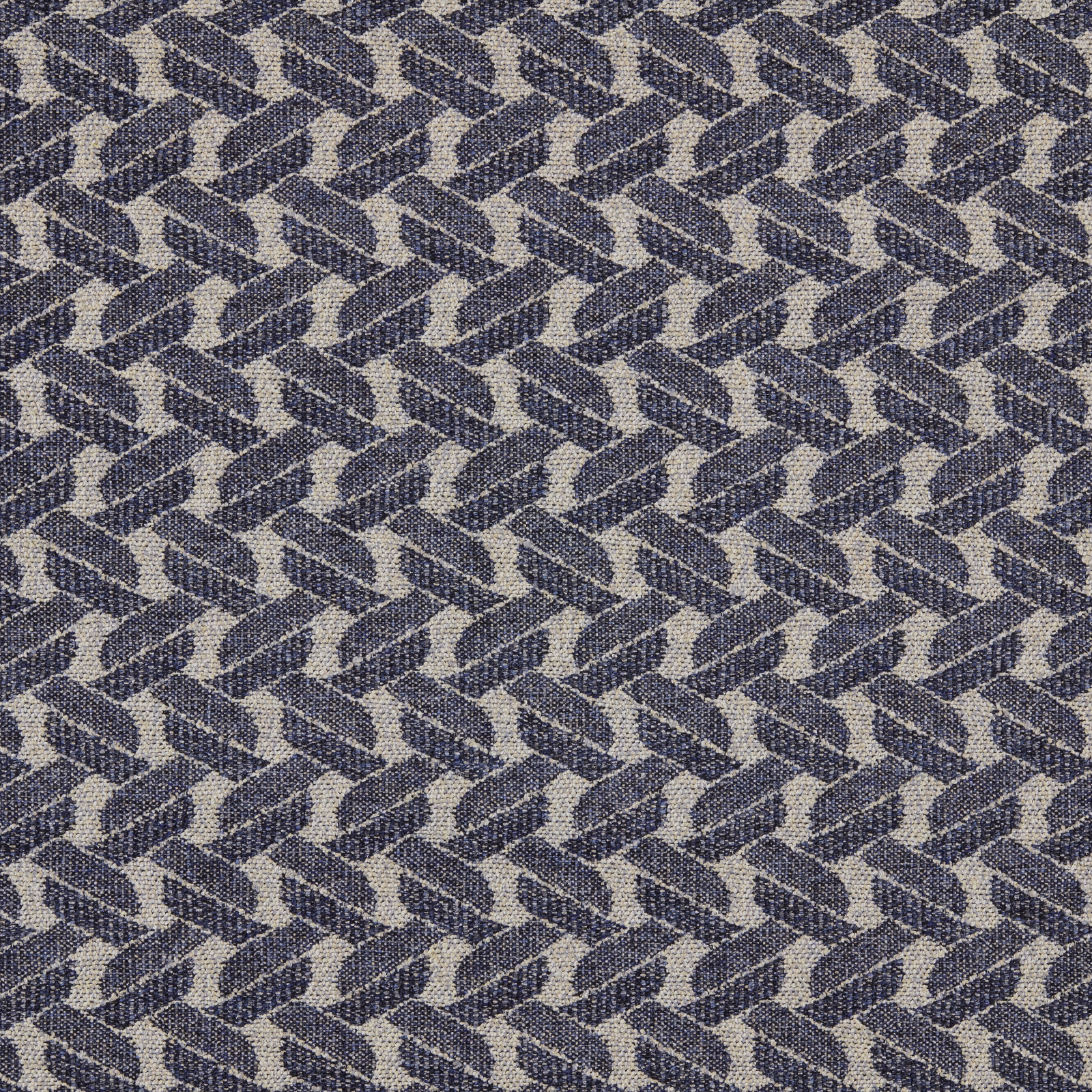 Close-up of indigo and pale neutral geometric woven upholstery fabric