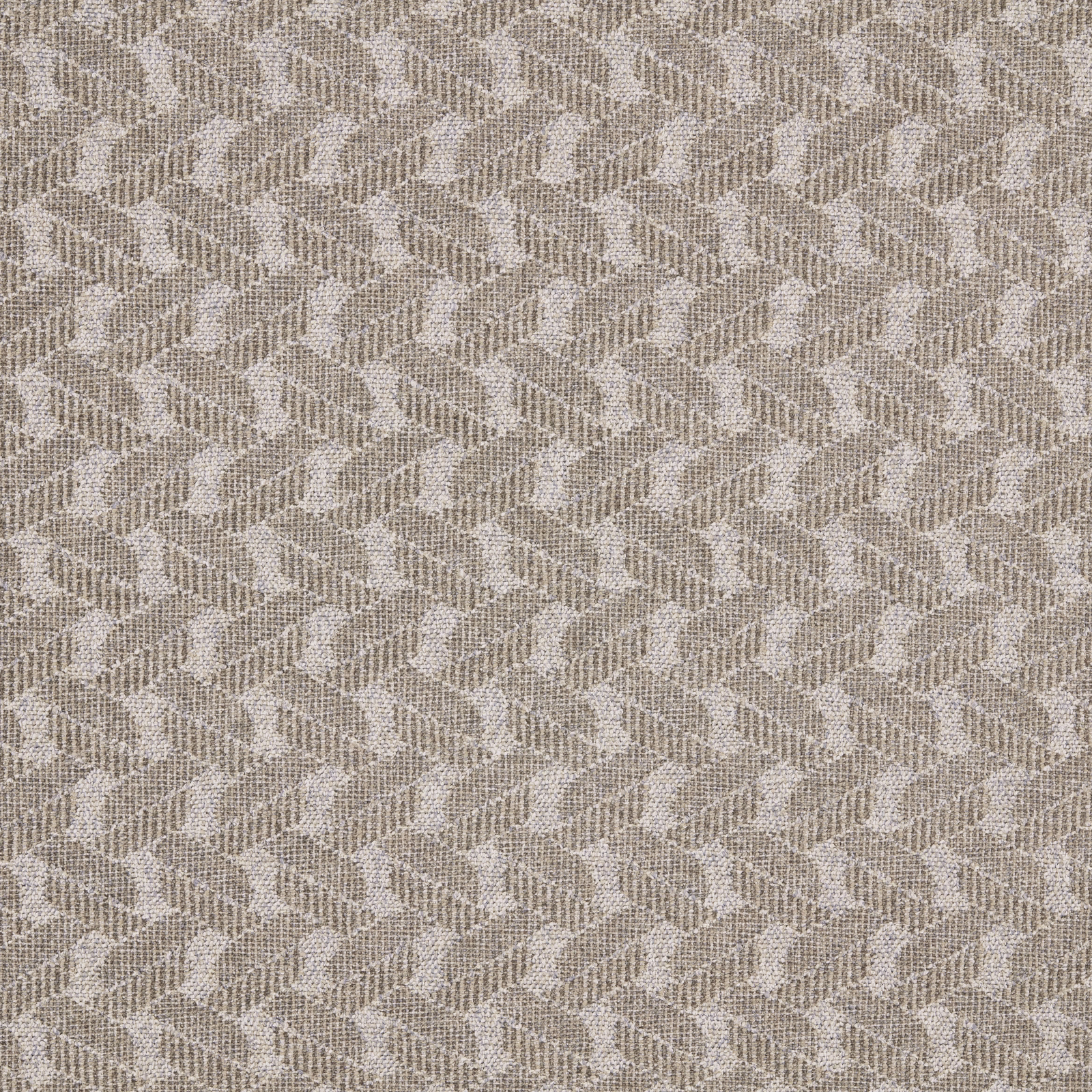 Close-up of a soft beige geometric woven upholstery fabric with small repeating motif