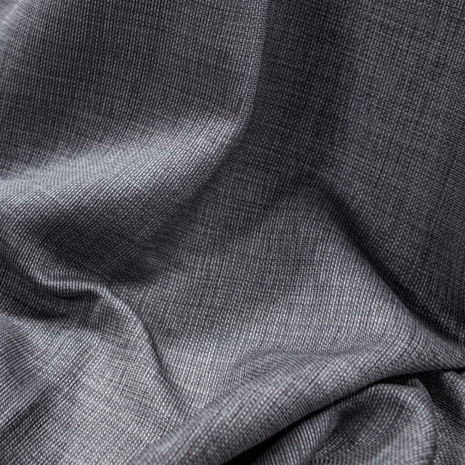Charcoal-grey Parga fabric showing fine woven texture across softly folded cloth