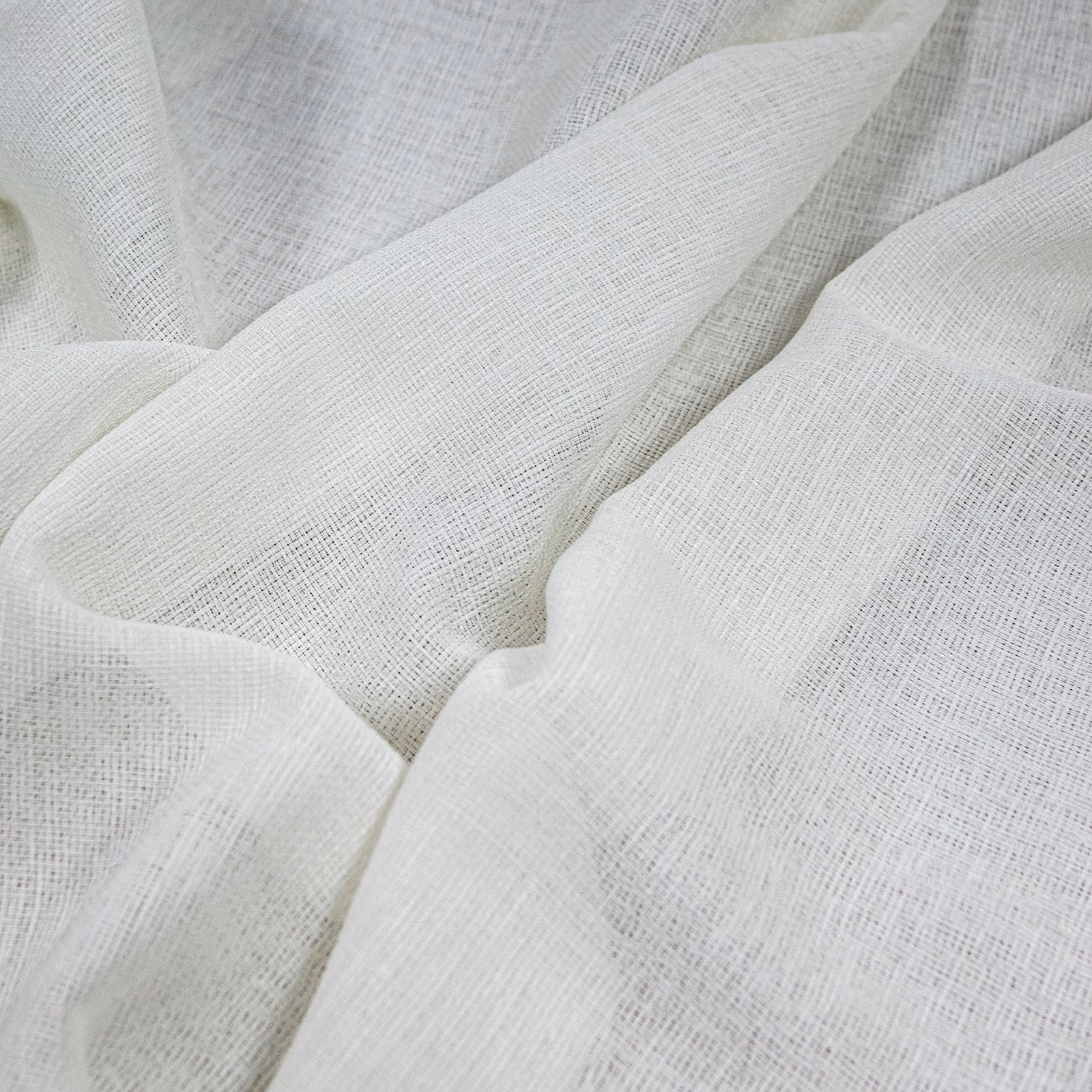 Cool optic-white fabric with a fine open crosshatch weave in soft folds