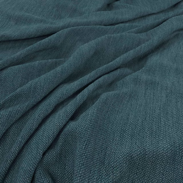 Deep blue-green teal woven fabric with a finely pebbled texture in soft folds