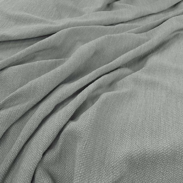 Muted duck egg blue fabric with a fine pebbled weave in softly draped folds