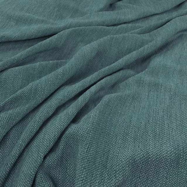 Muted lagoon-teal fabric with fine pebbled weave gathered into soft folds