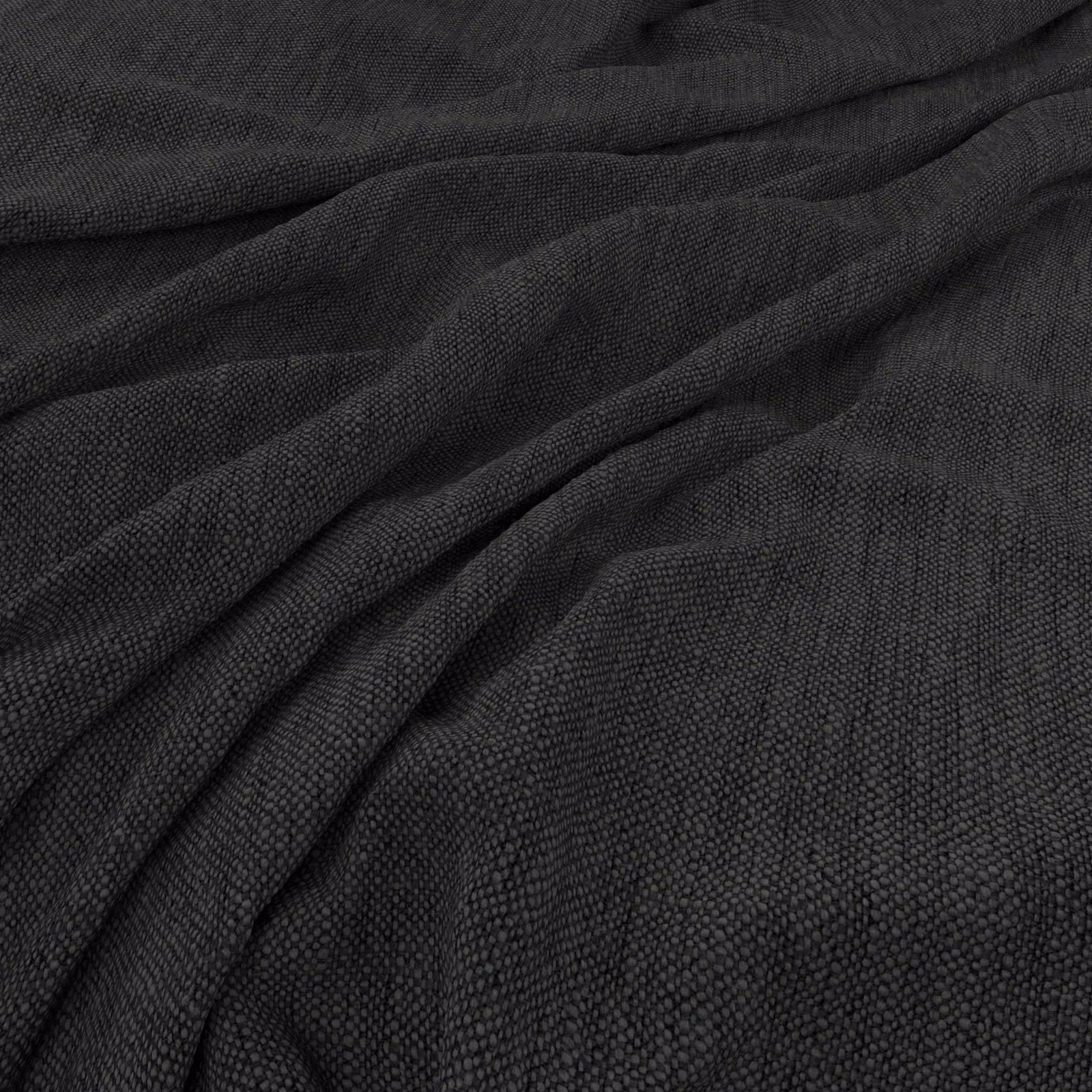 Deep charcoal-black woven fabric showing fine pebbled texture in gathered folds