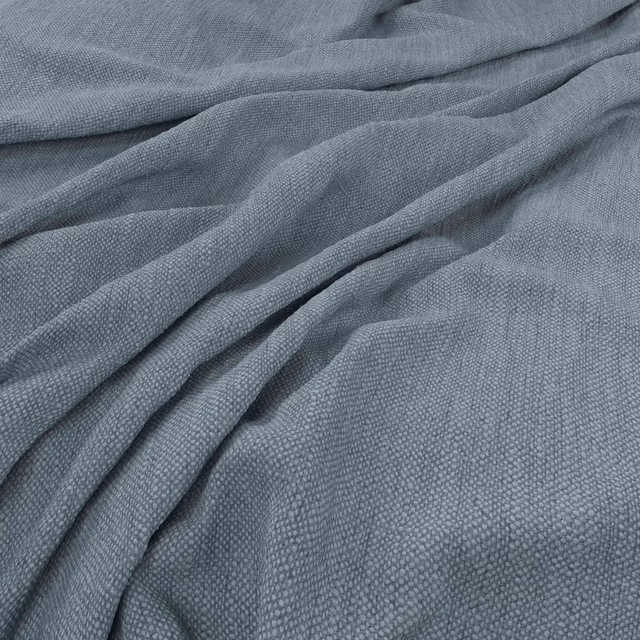 Cool blue-grey woven fabric with fine pebbled texture gathered into soft folds